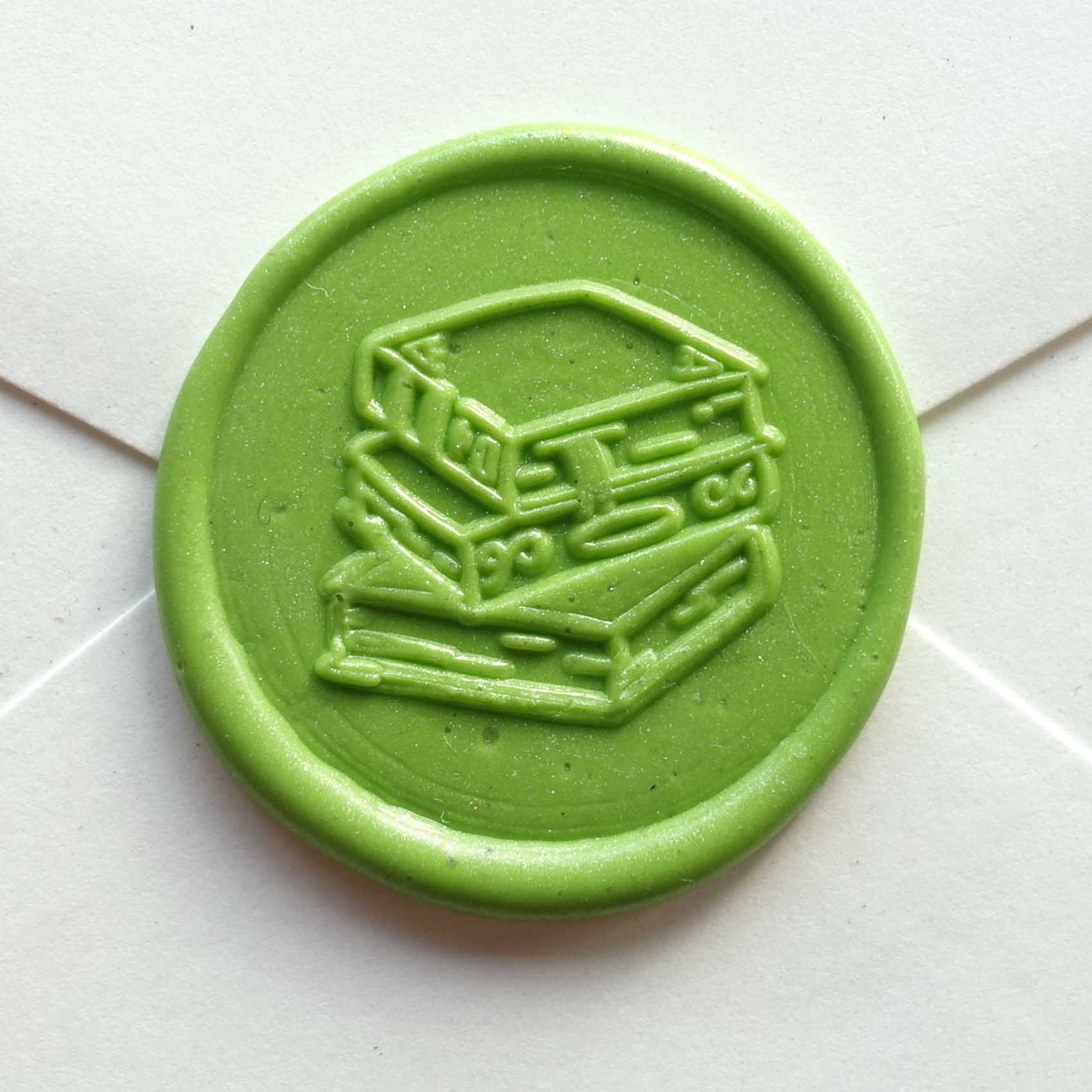 stack of books wax seal stamp fiona ariva australia