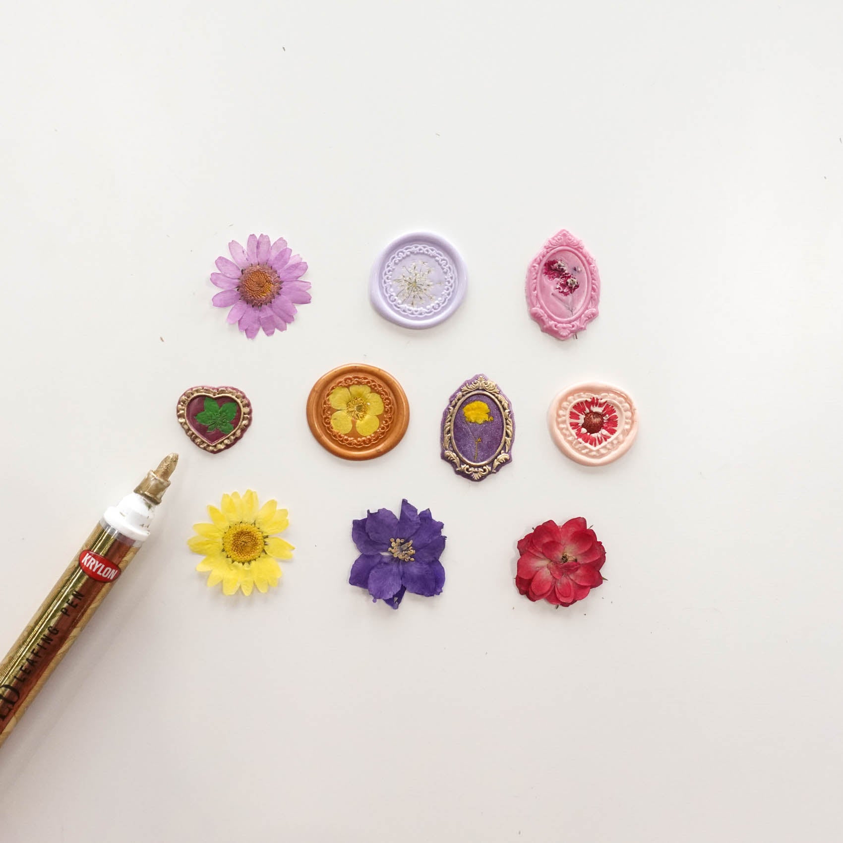 dried flowers in clear wax seal with antique border