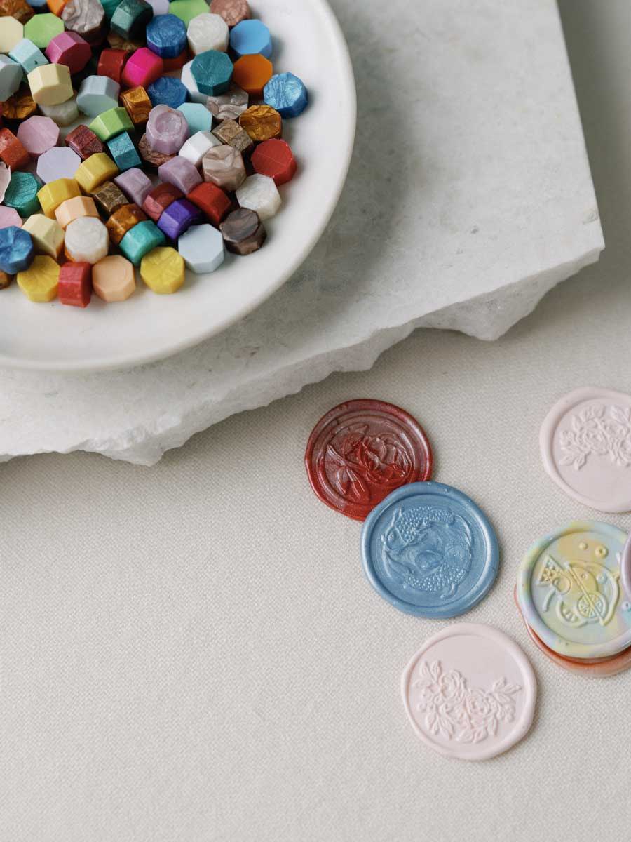 Sealing wax beads and wax seals
