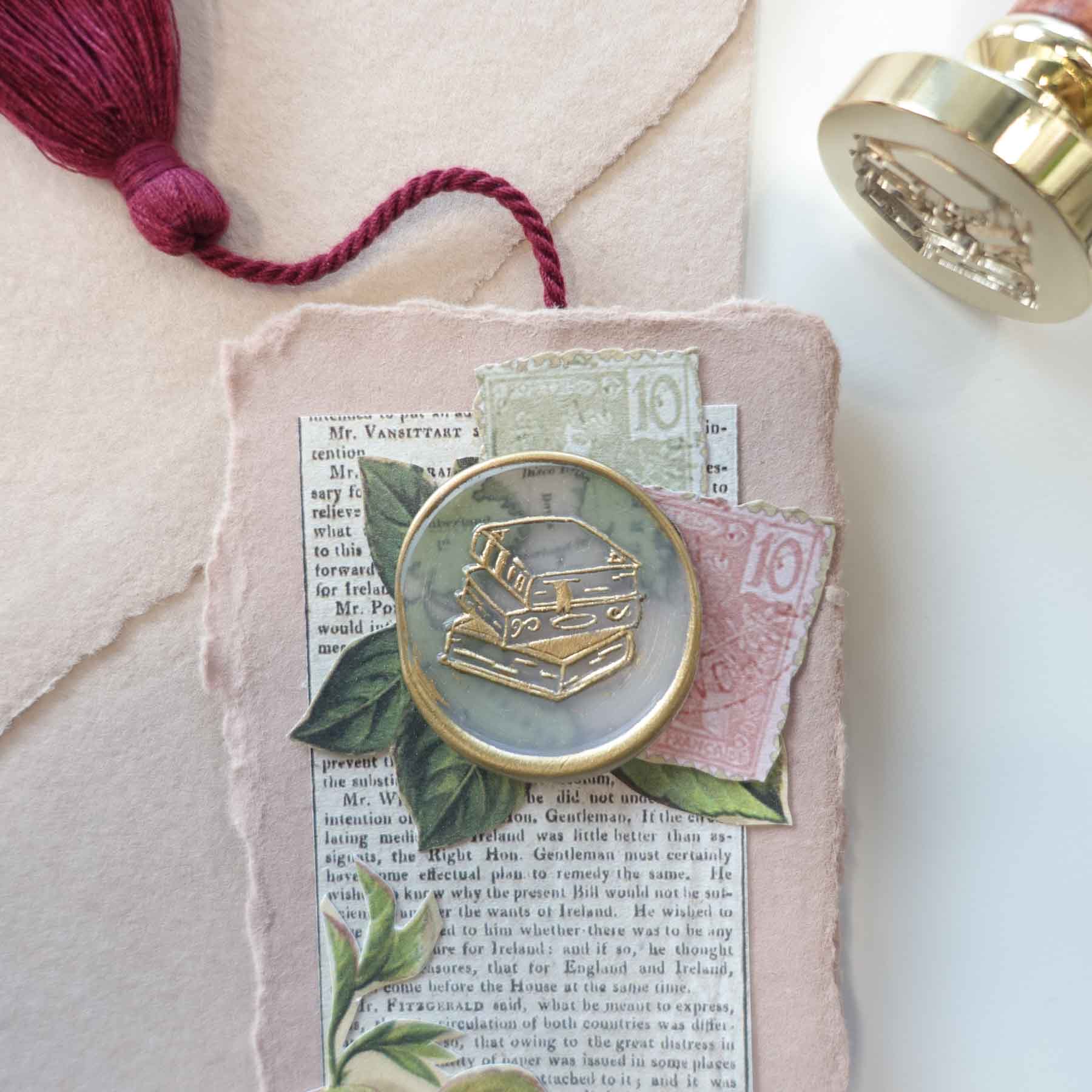 stack of books wax seal stamp bookmark with tassle fiona ariva australia