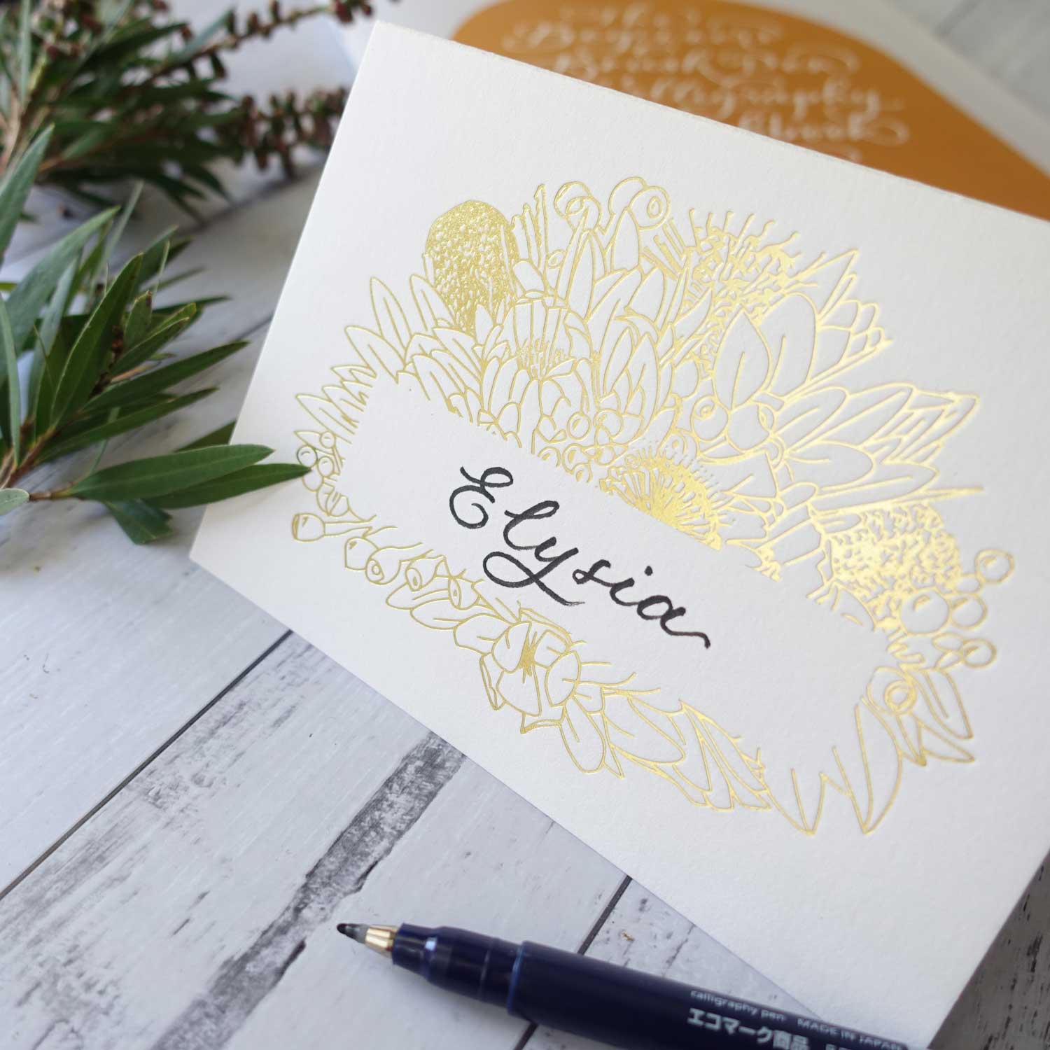 Gold foil calligraphy greeting card with Australian native botanical drawings