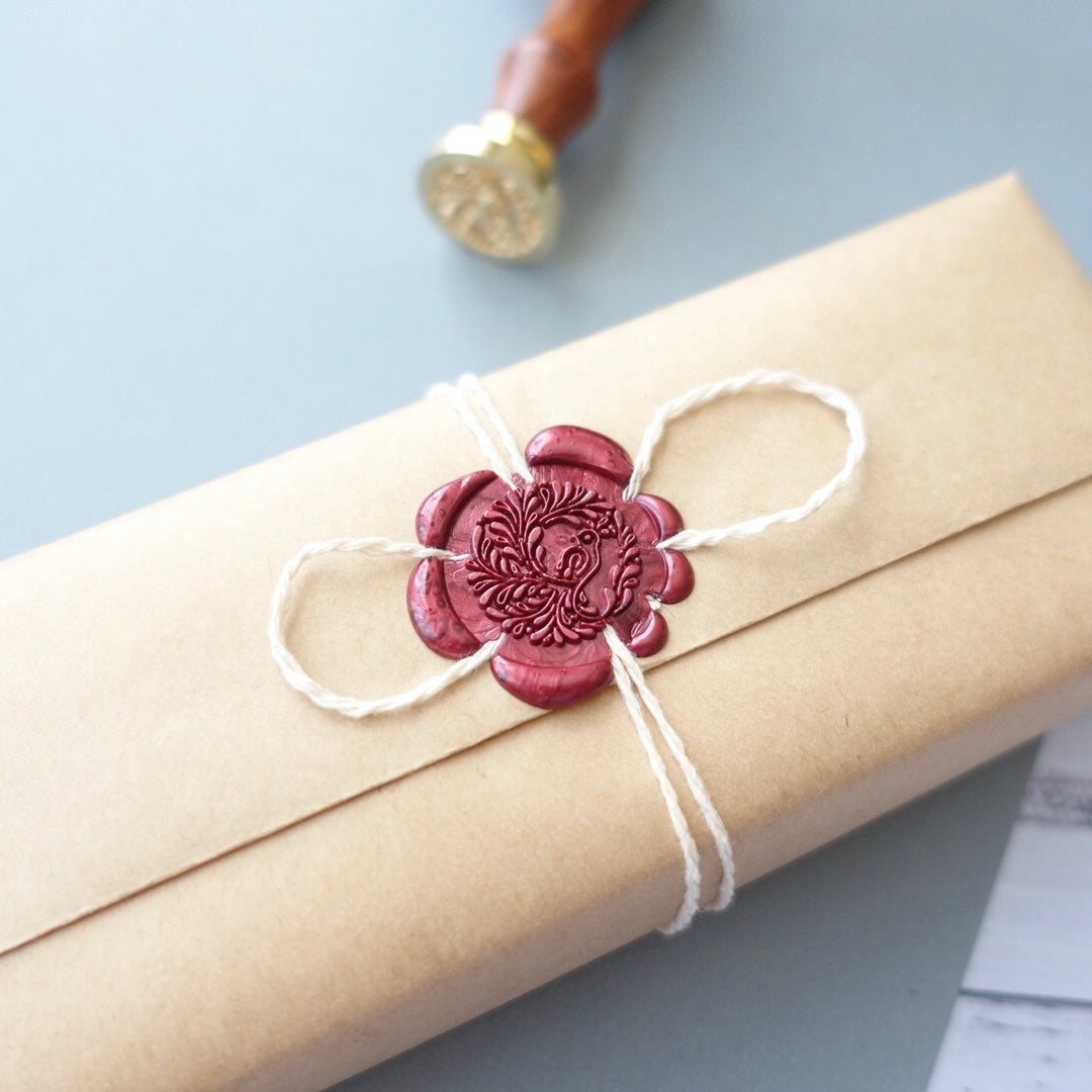 Wax seal peacock present wrapping idea with twine