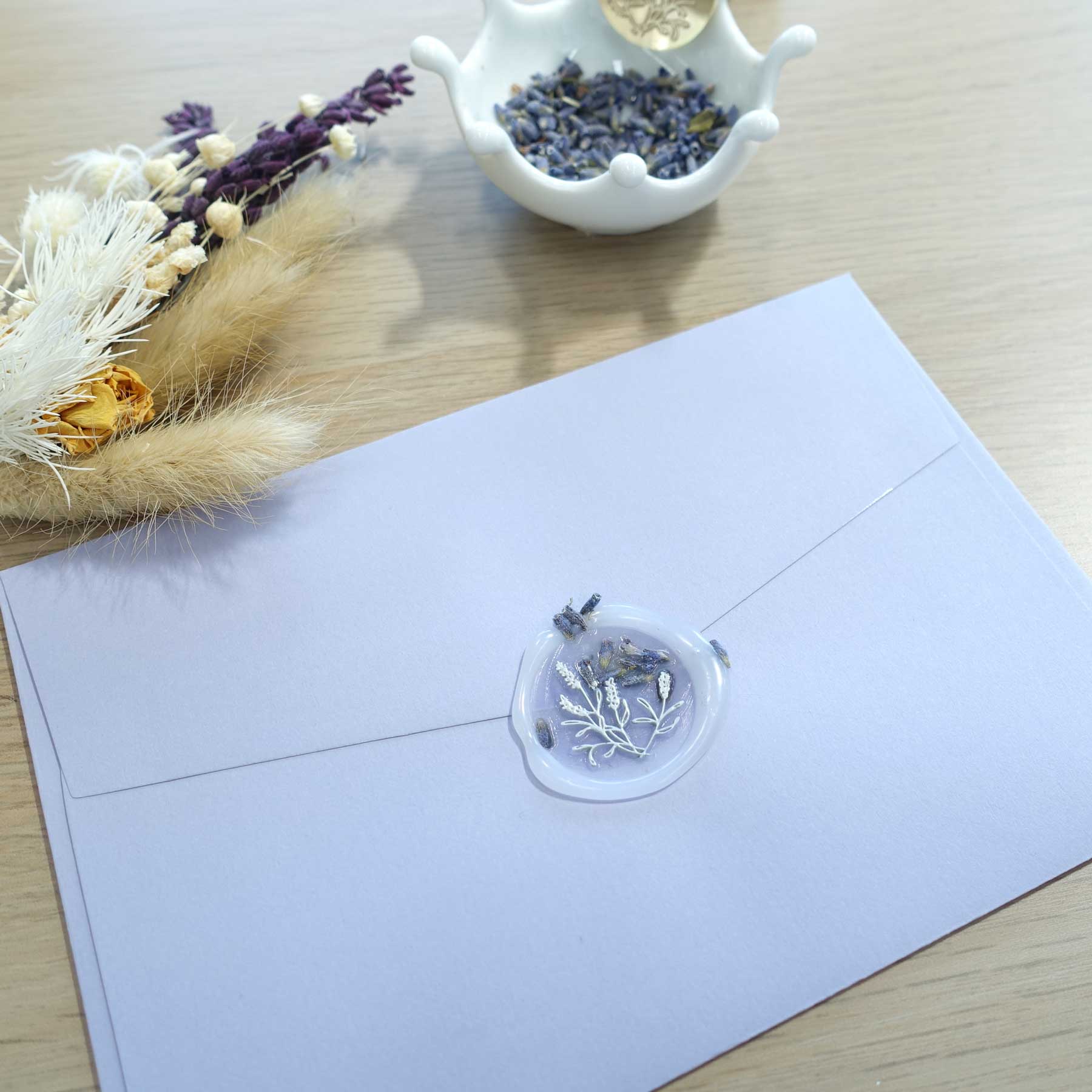 semi transparent clear wax with dried lavender flowers
