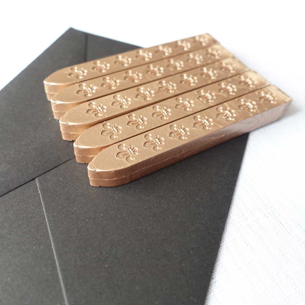 5 pack of wickless wax sticks for wax seals in a rose gold champagne metallic colour