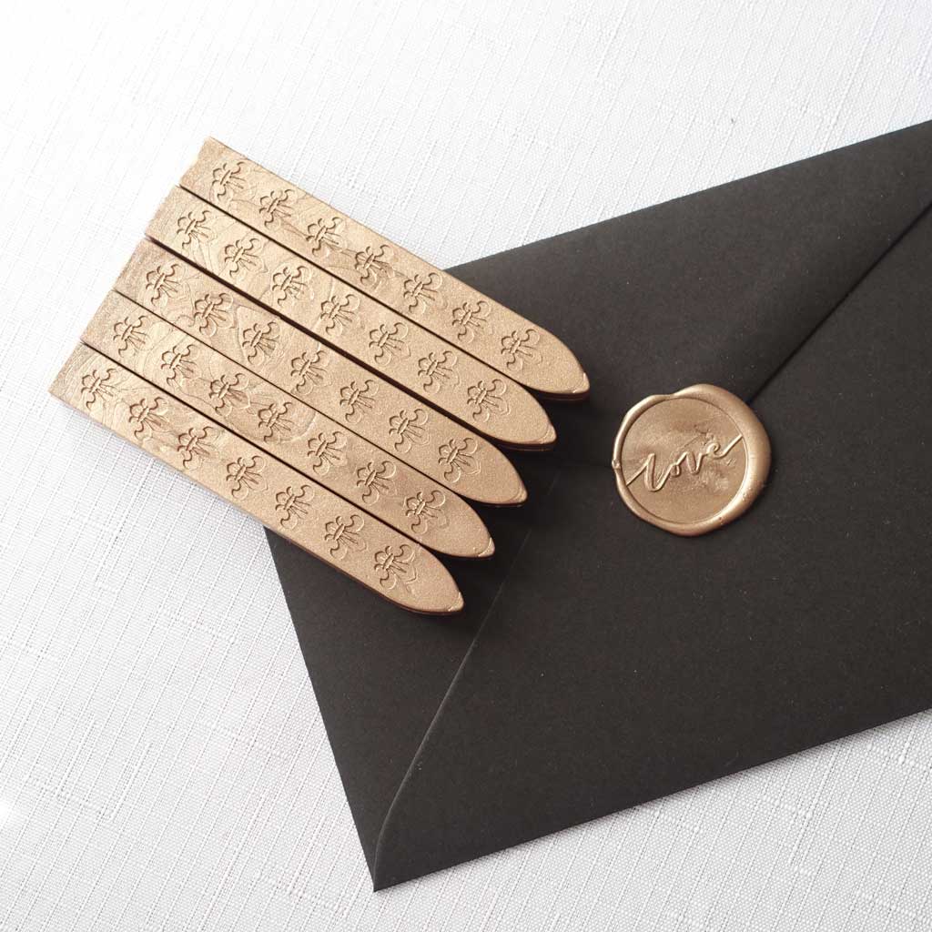 5 pack of wickless wax sticks for wax seals in a rose gold champagne metallic colour