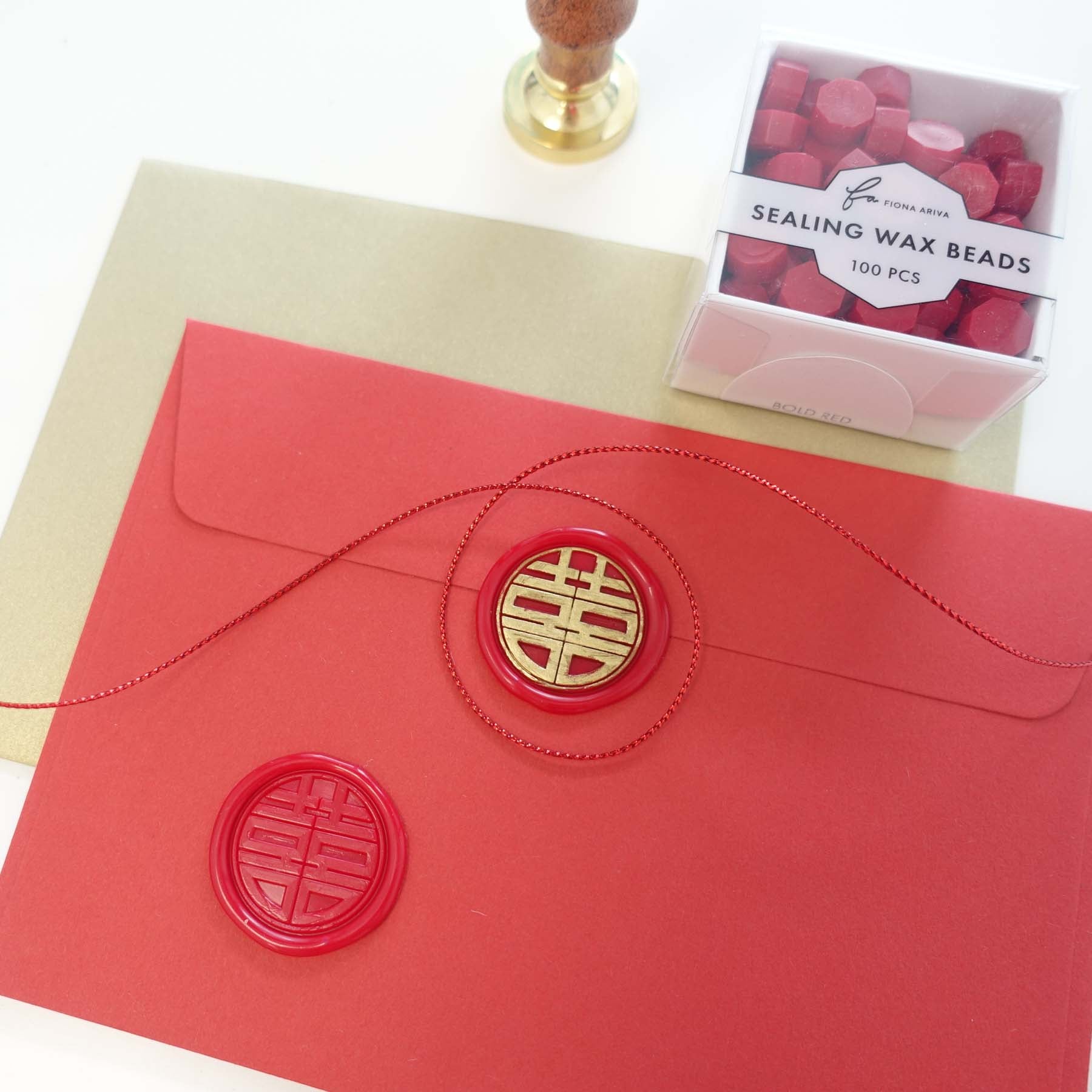 double happiness wax seal on red and gold wedding invitations envelope stamp fiona ariva australia