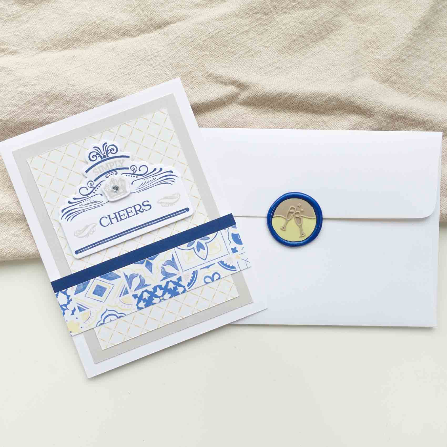 handmade cheers card with wax seal clinking champagne glasses