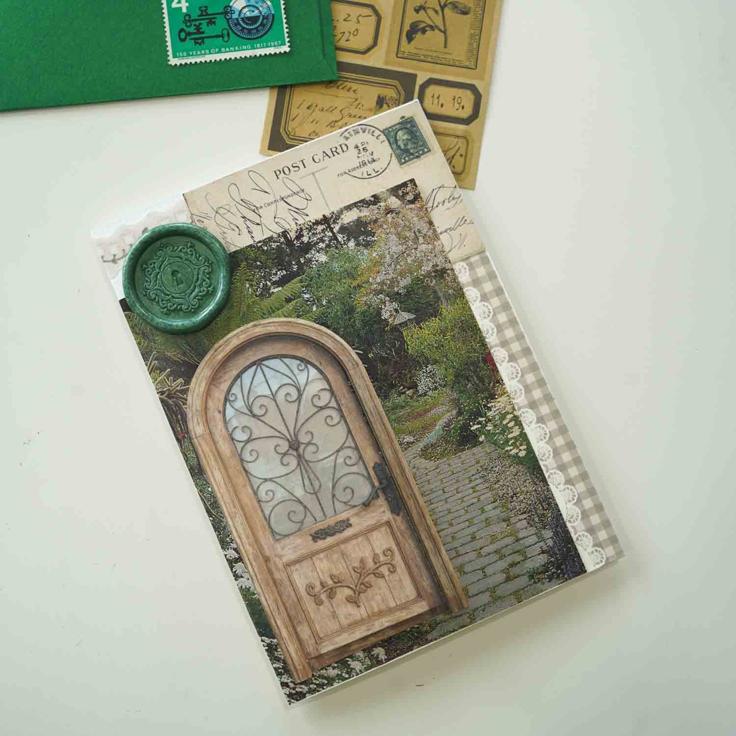 A decorative postcard or card featuring a vintage wooden door and garden path, with a keyhole wax seal