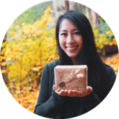 Fiona Ariva, founder, holding a wax sealed gift