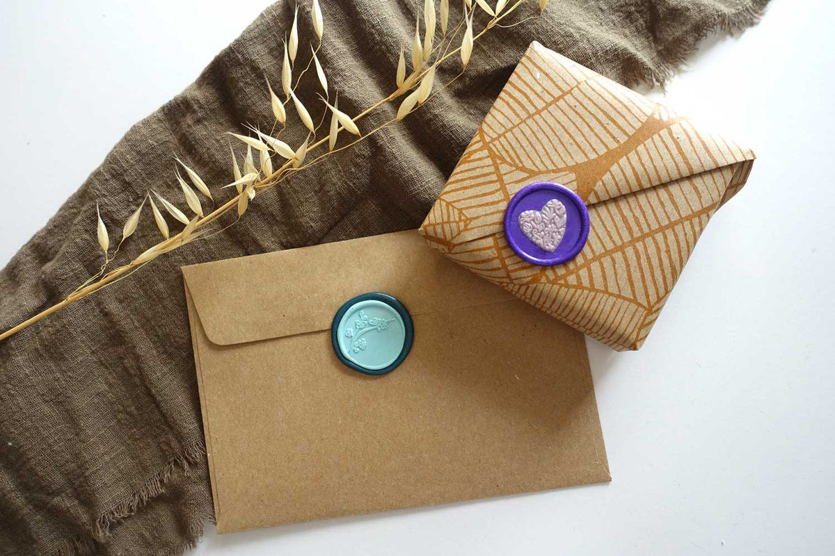Double layered wax seals on kraft envelopes