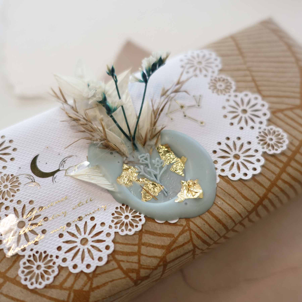 Step 4: decorations including dried flowers, foil flakes and tassels