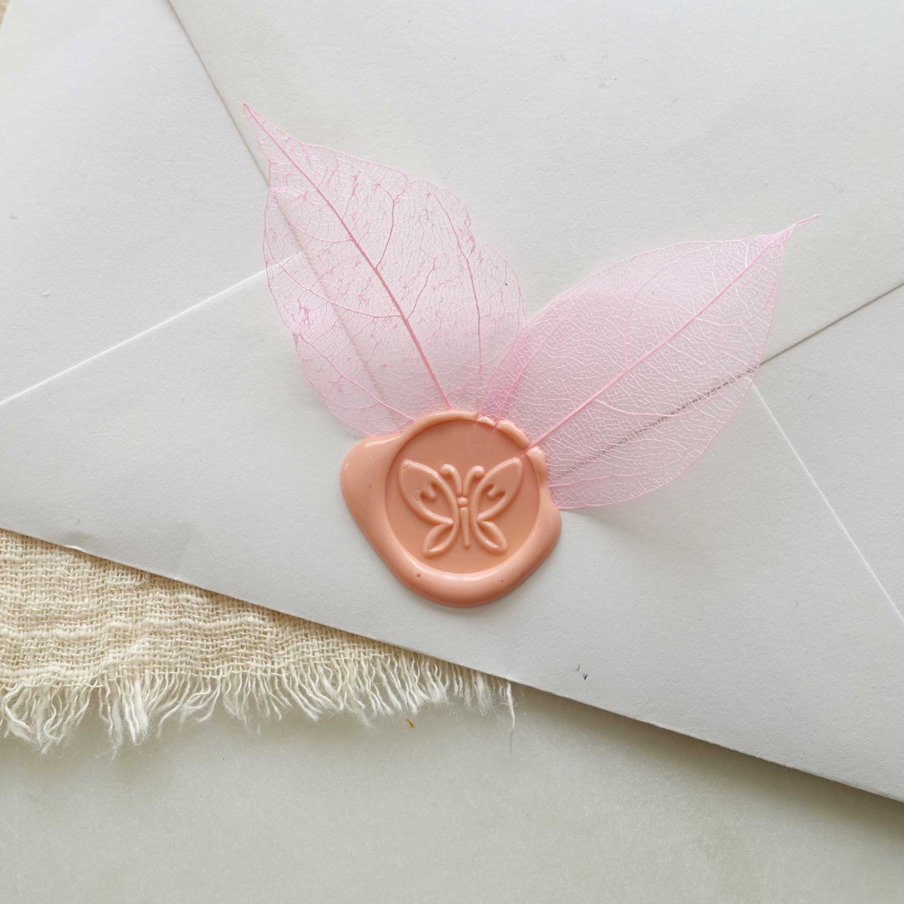 butterfly wax seal with pink skeleton leaves on envelope fiona ariva australia