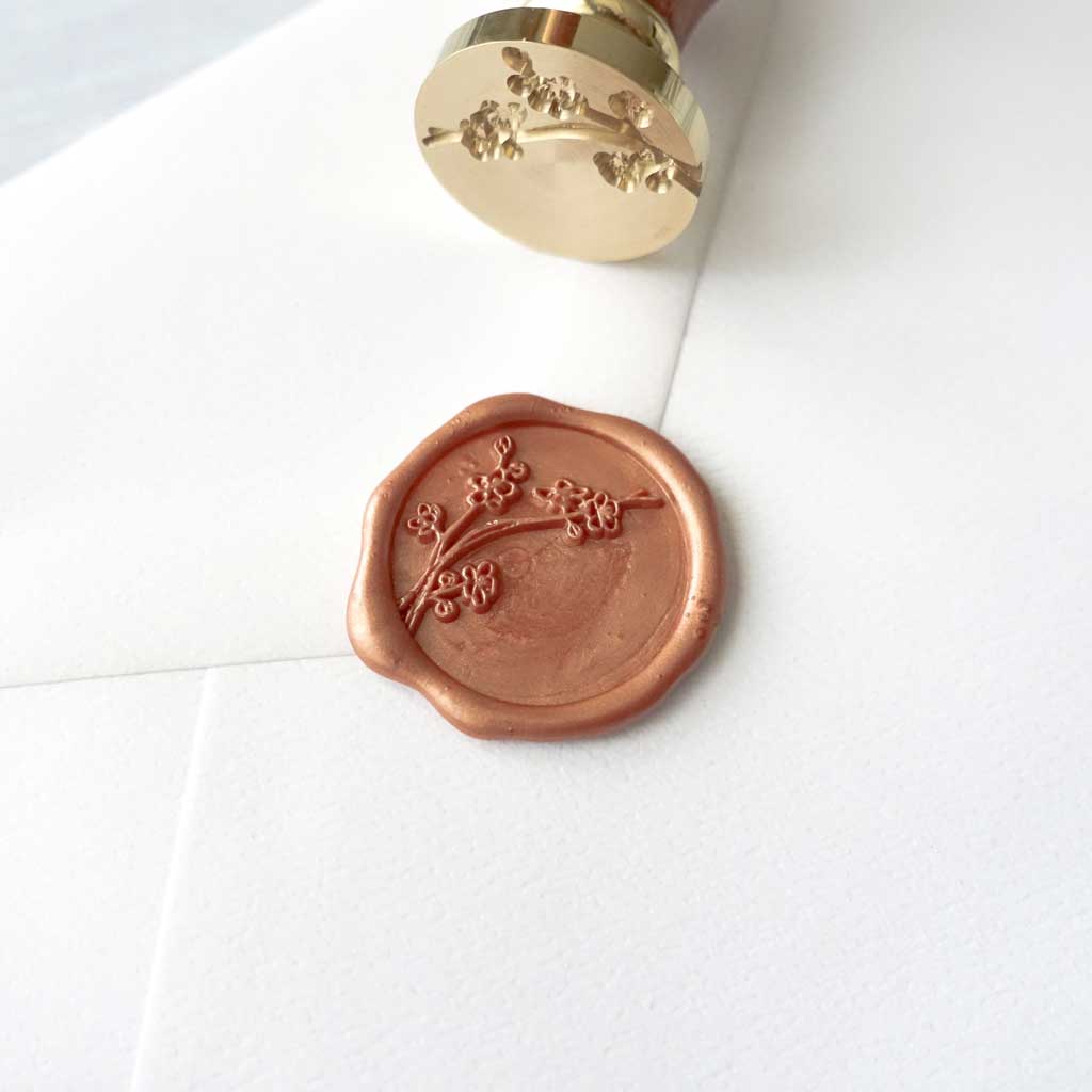 Cherry blossom sakura wax seal in peach copper with stamp on envelope