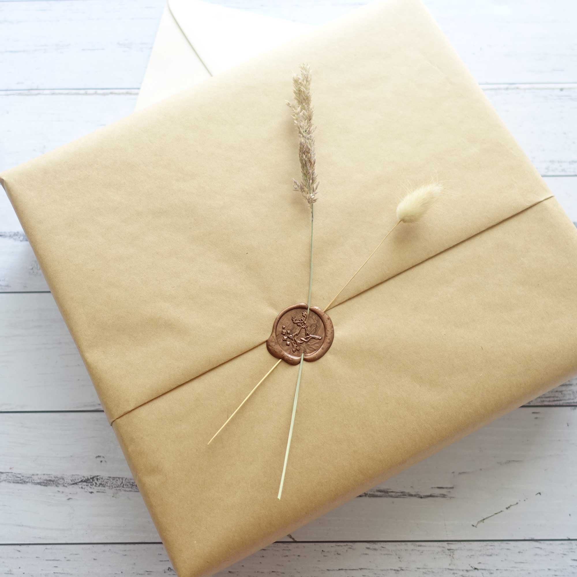 Gift wrapping idea with reindeer christmas wax seal