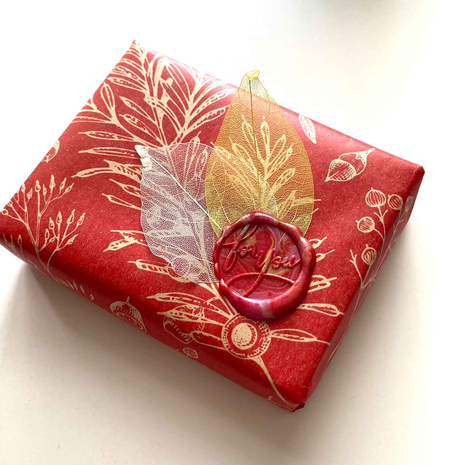 For you red wax seal design with dried skeleton leaves
