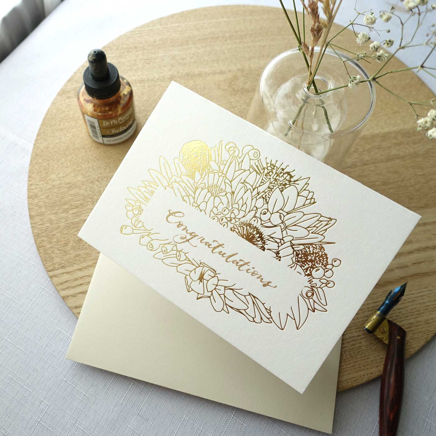 Gold foiled greeting card with Congratulations handwritten in calligraphy