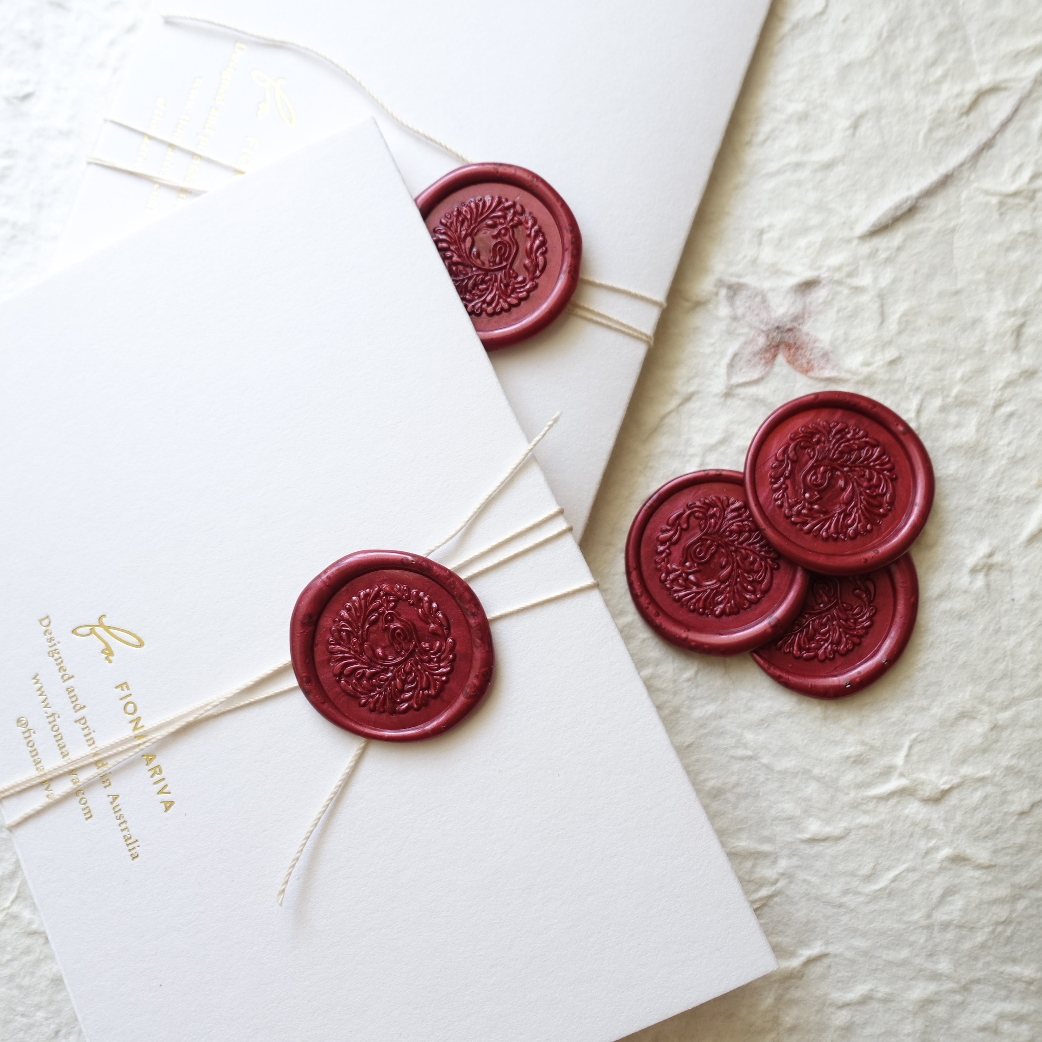 Burgundy wine song bird wax seals wedding invitations