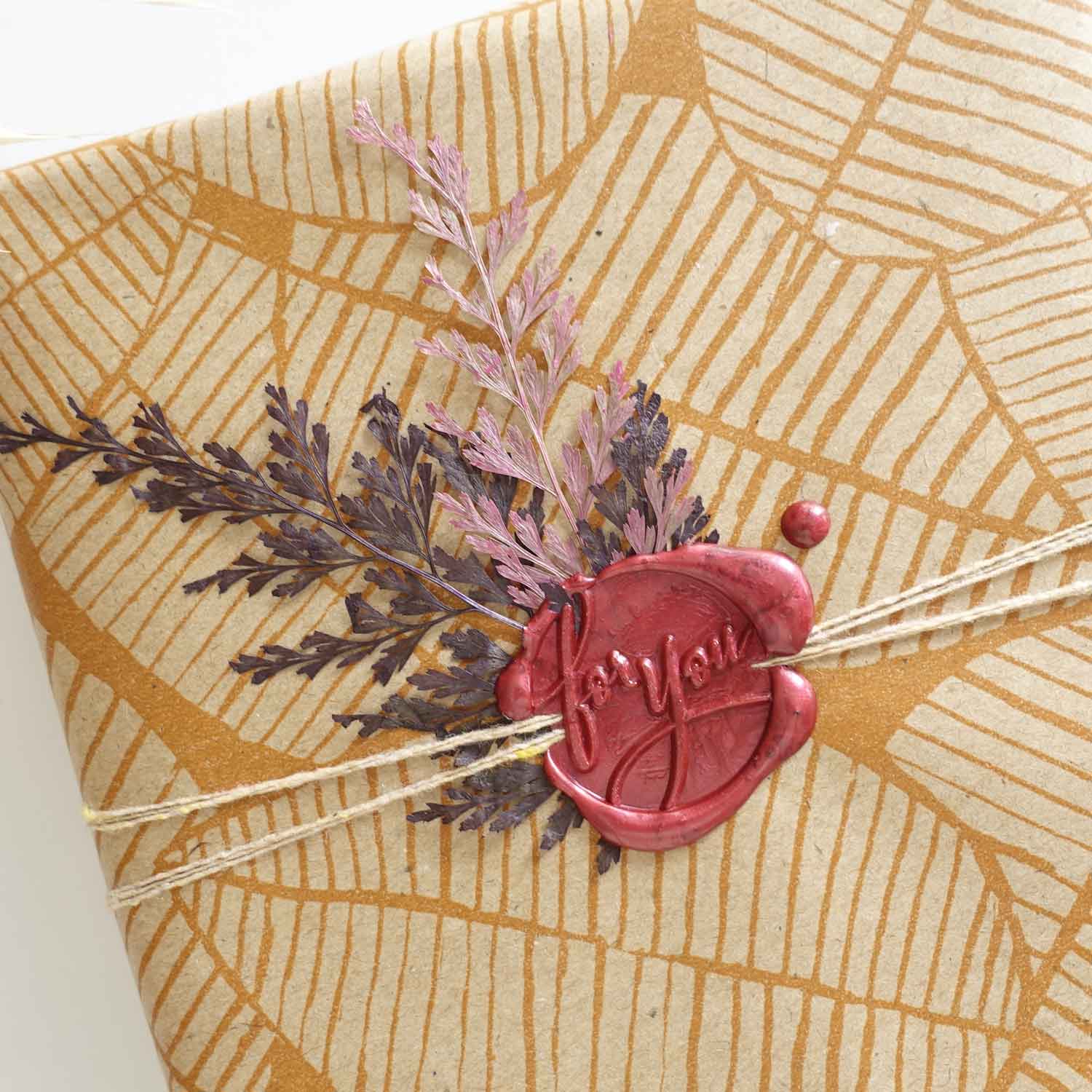 For you burgundy wax seal with dried leaves gift wrapping idea