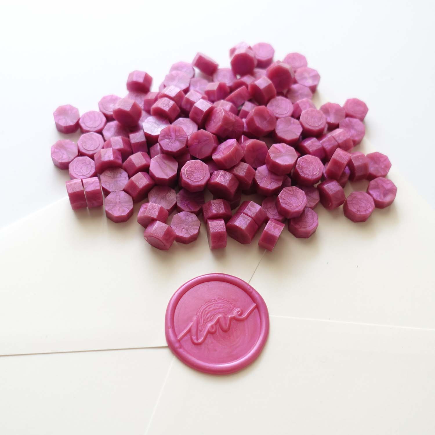fuchsia hot bright pink sealing wax beads with love wax seal on envelope australia