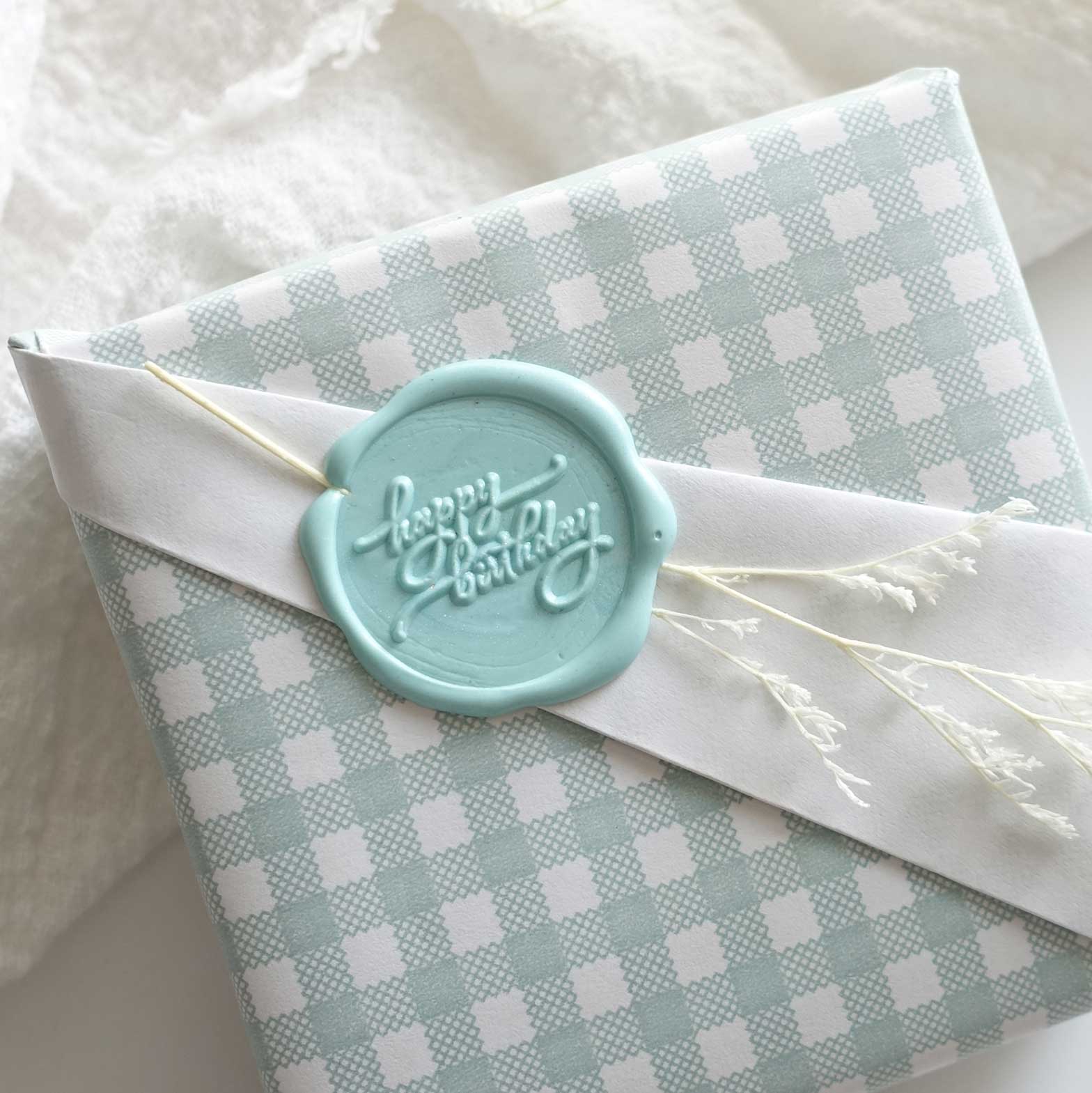 Happy birthday wax seal with gingham wrapping paper