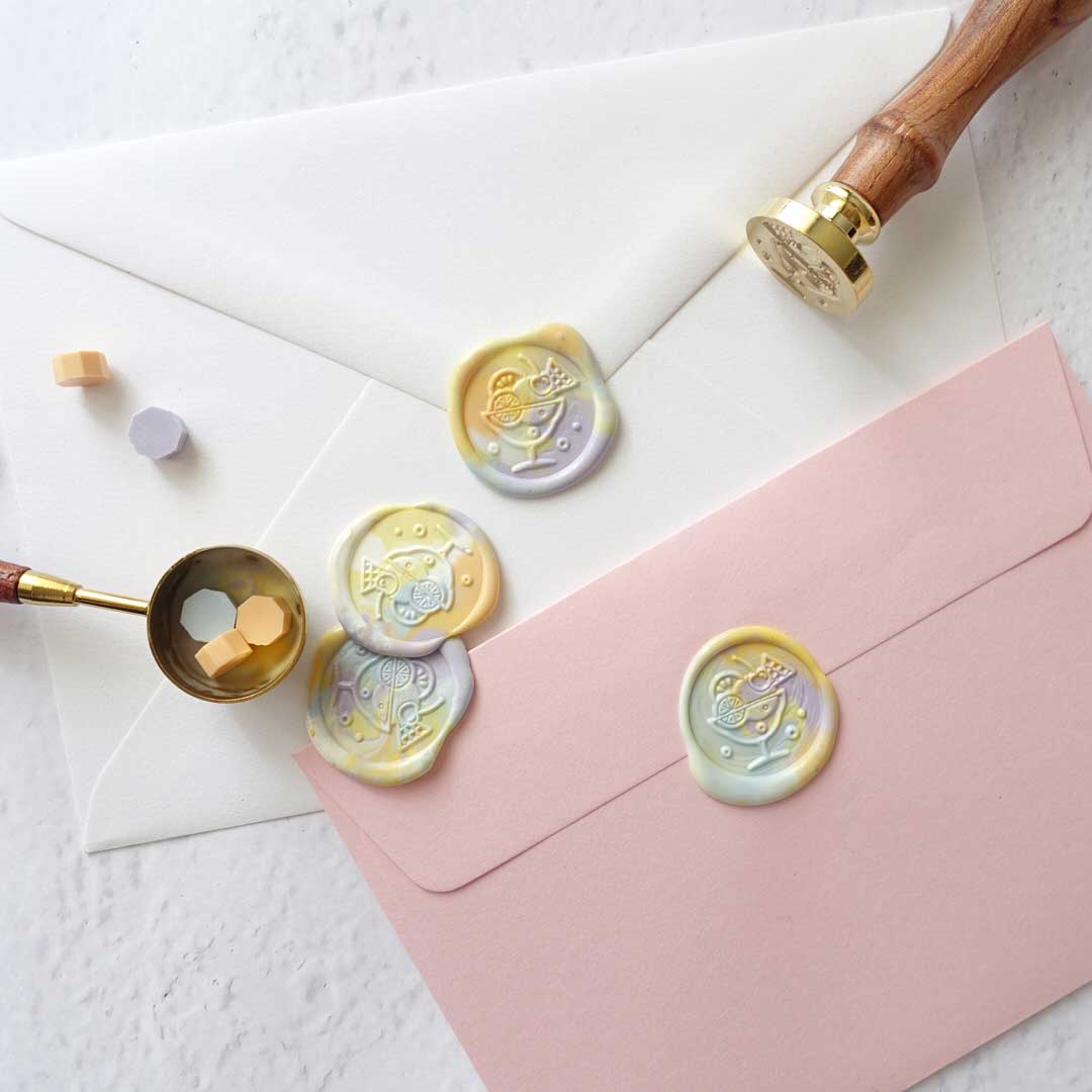 Ice cream wax seals on candy pink envelope with pastel wax