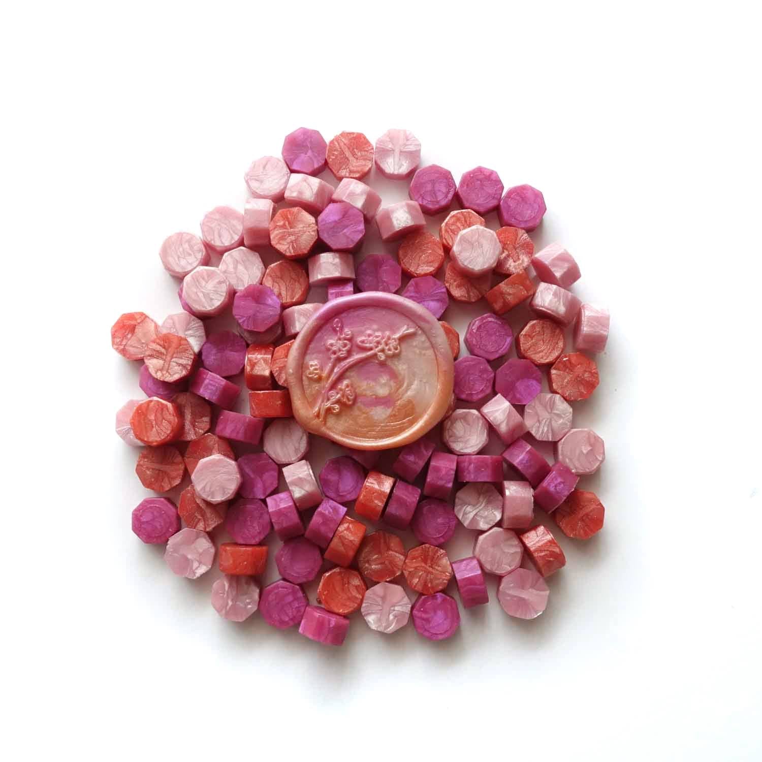 Cherry blossom wax seal with coral pink and fuchsia sealing wax granules Fiona Ariva