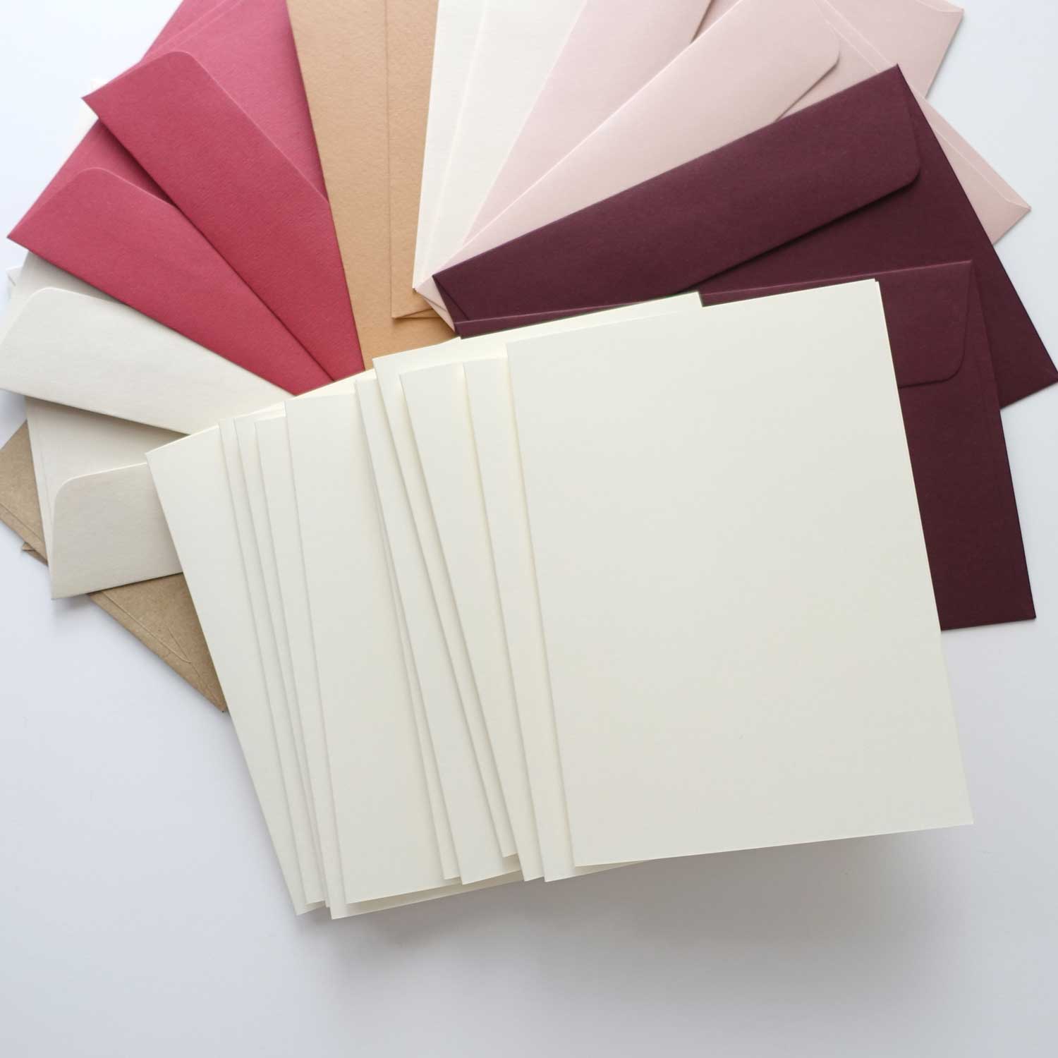 Cream blank cards with assorted pink envelopes