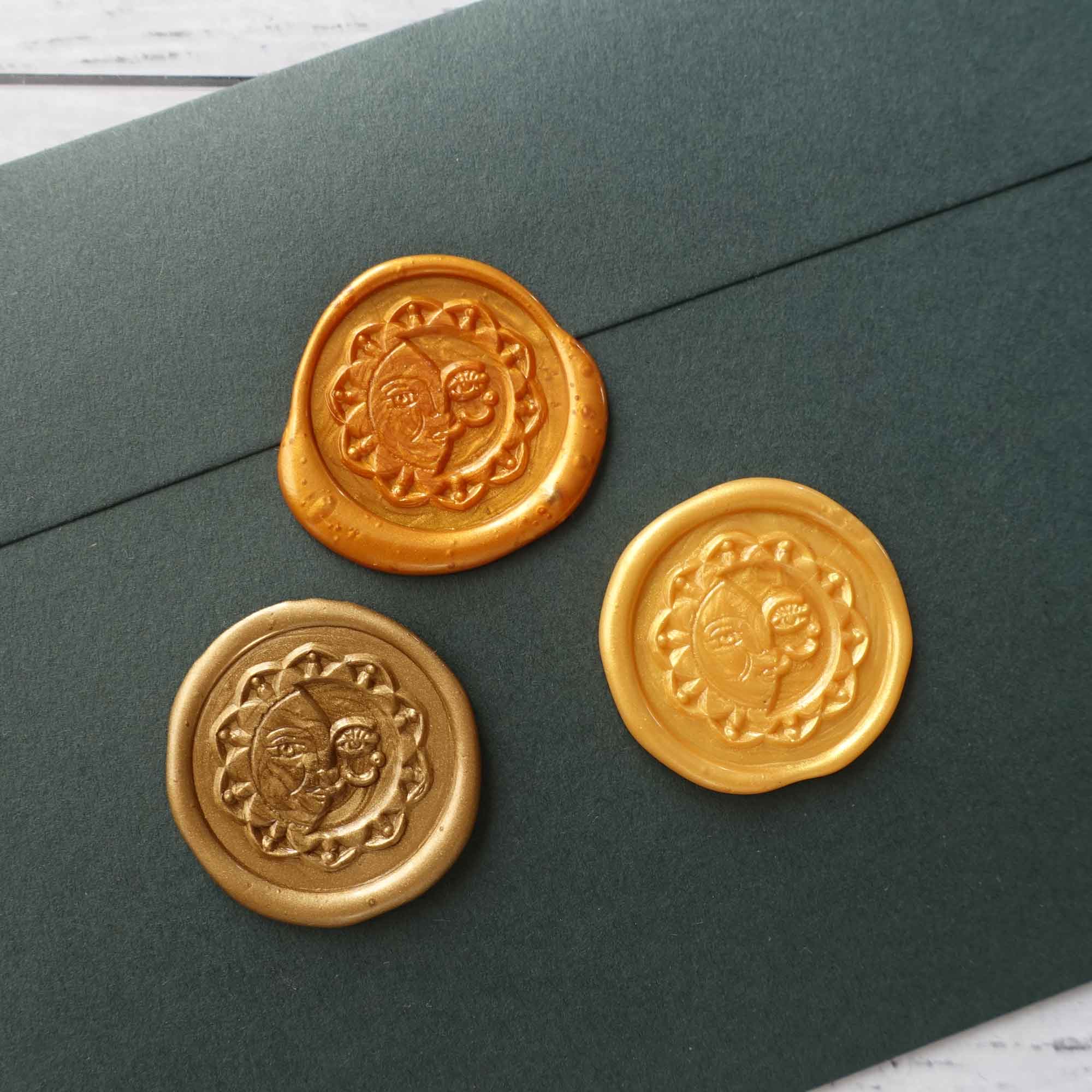 Sun and Moon bronze yellow amber gold wax seals on envelope