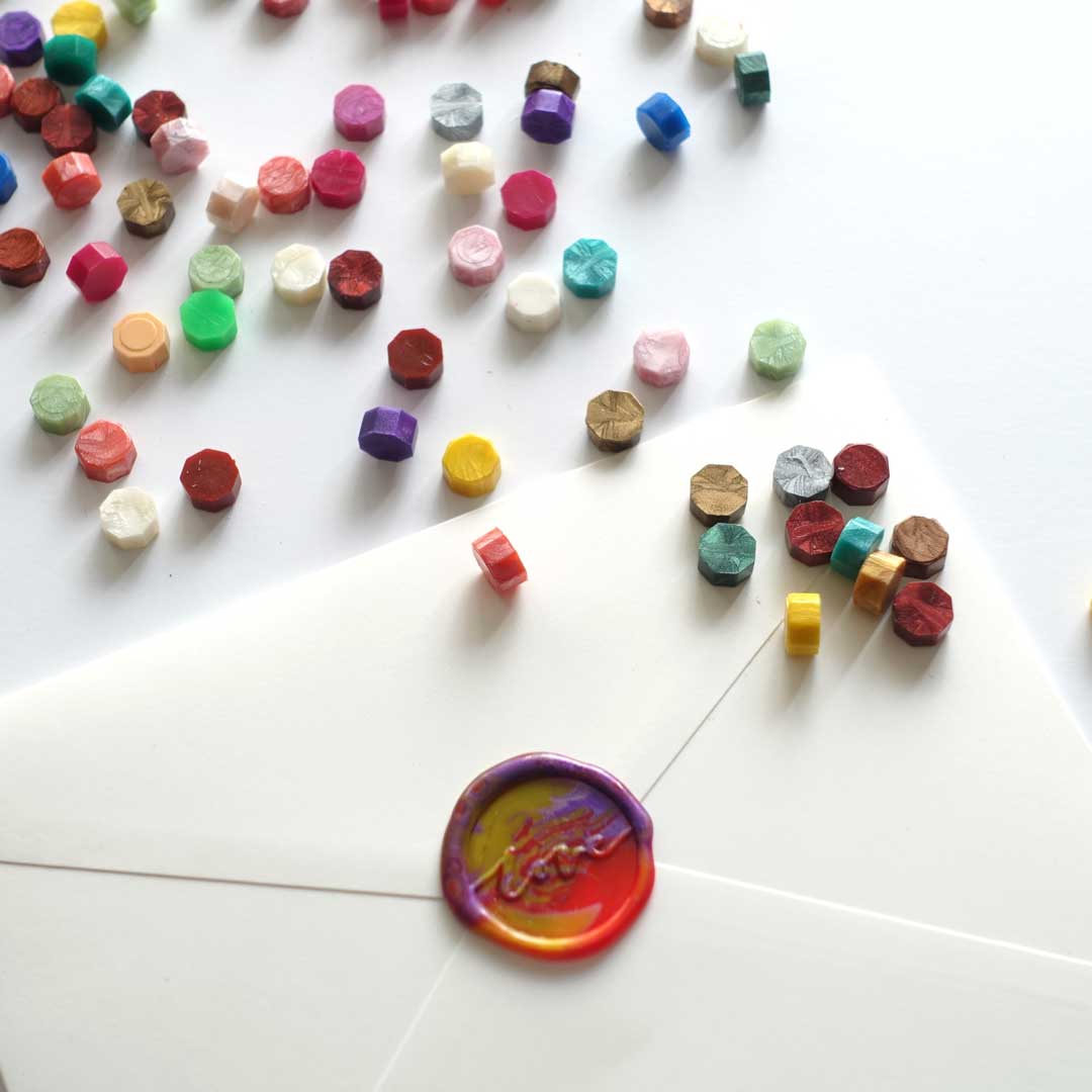 Multicolour mixed wax seals on envelope with love stamp