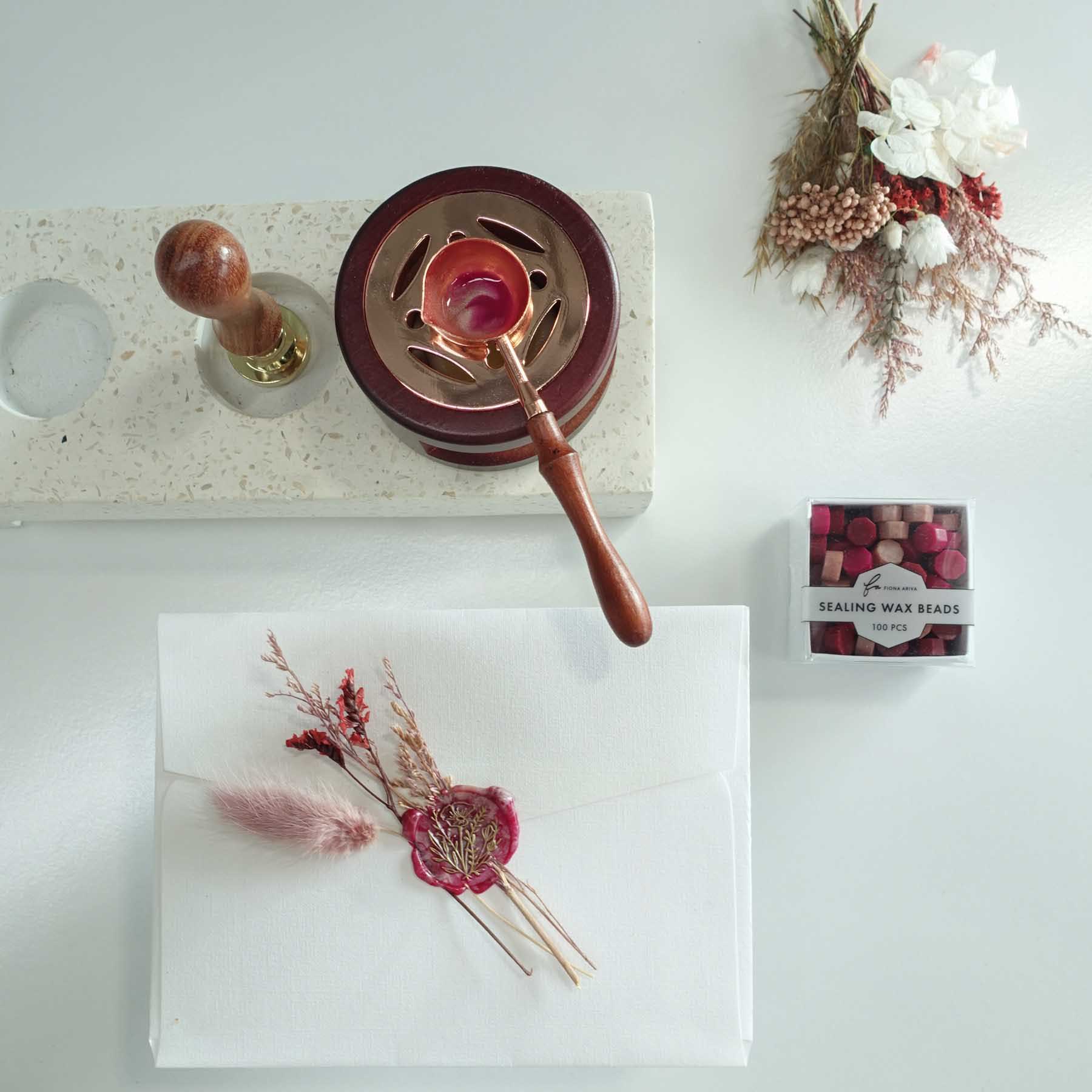 Mixed red sealing wax with blush dried flowers with wax seal envelope and rose gold spoon holder stove for wax seal stamp