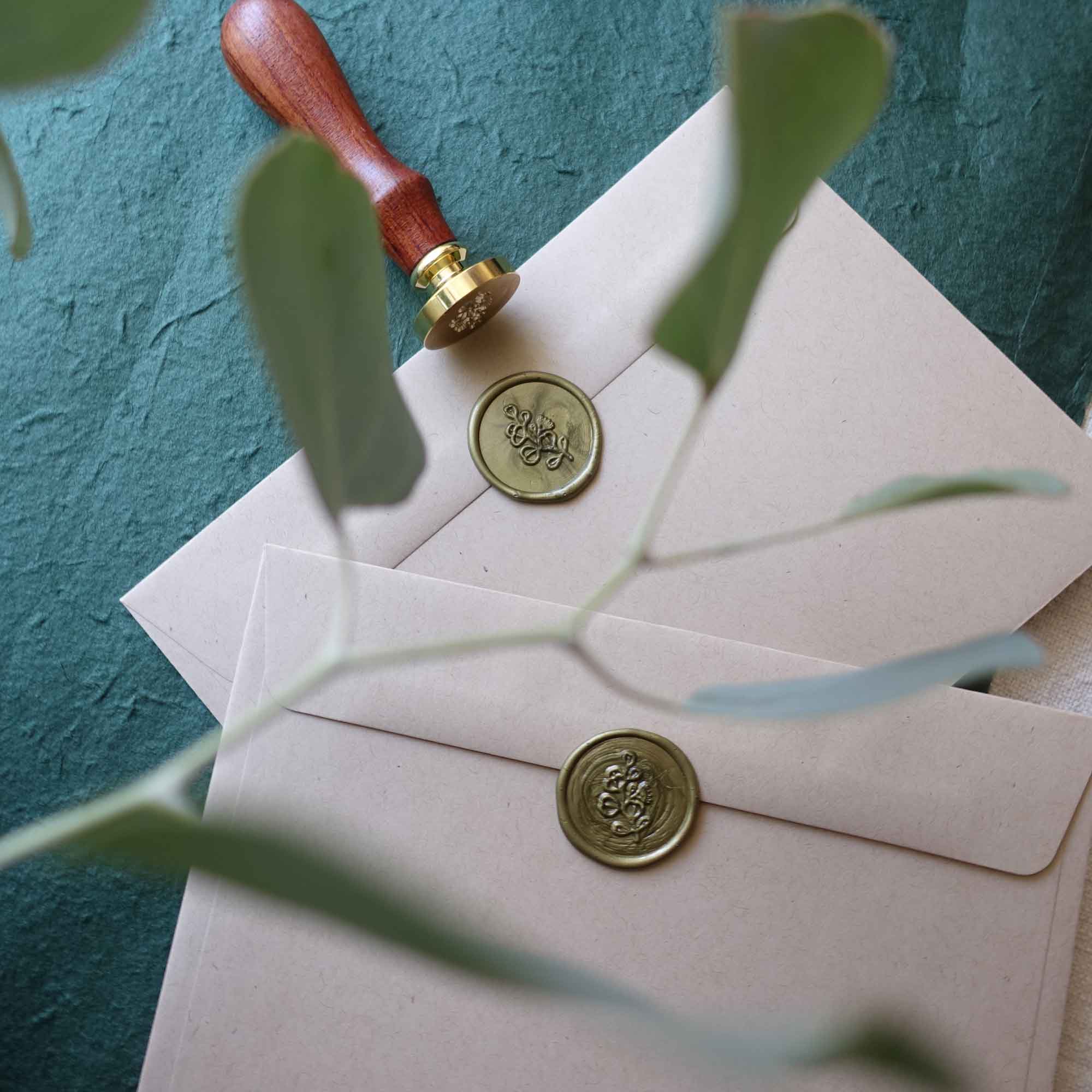 Green gold wax seal stamp with eucalyptus leaves