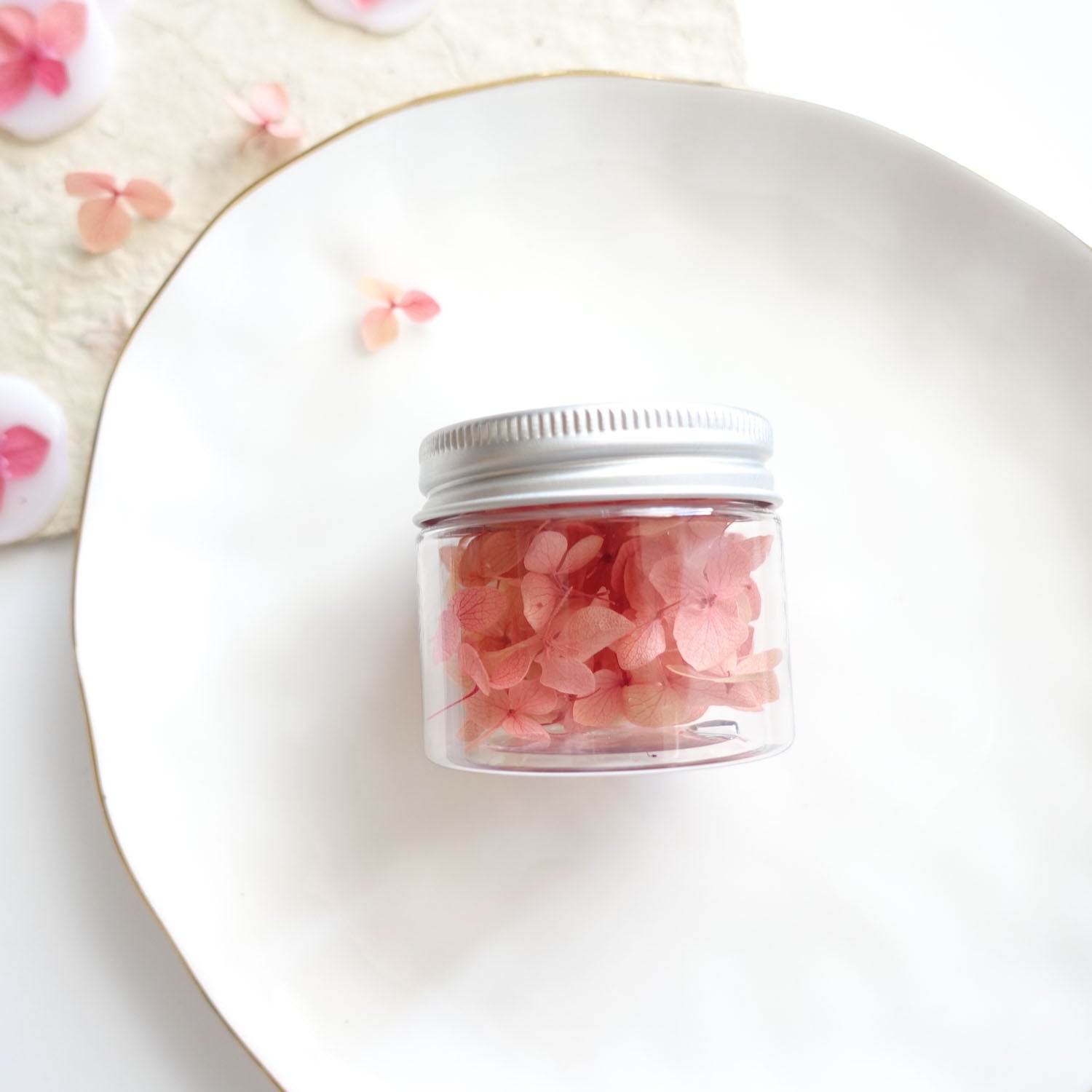 Jar of dried pink hydrangea flowers