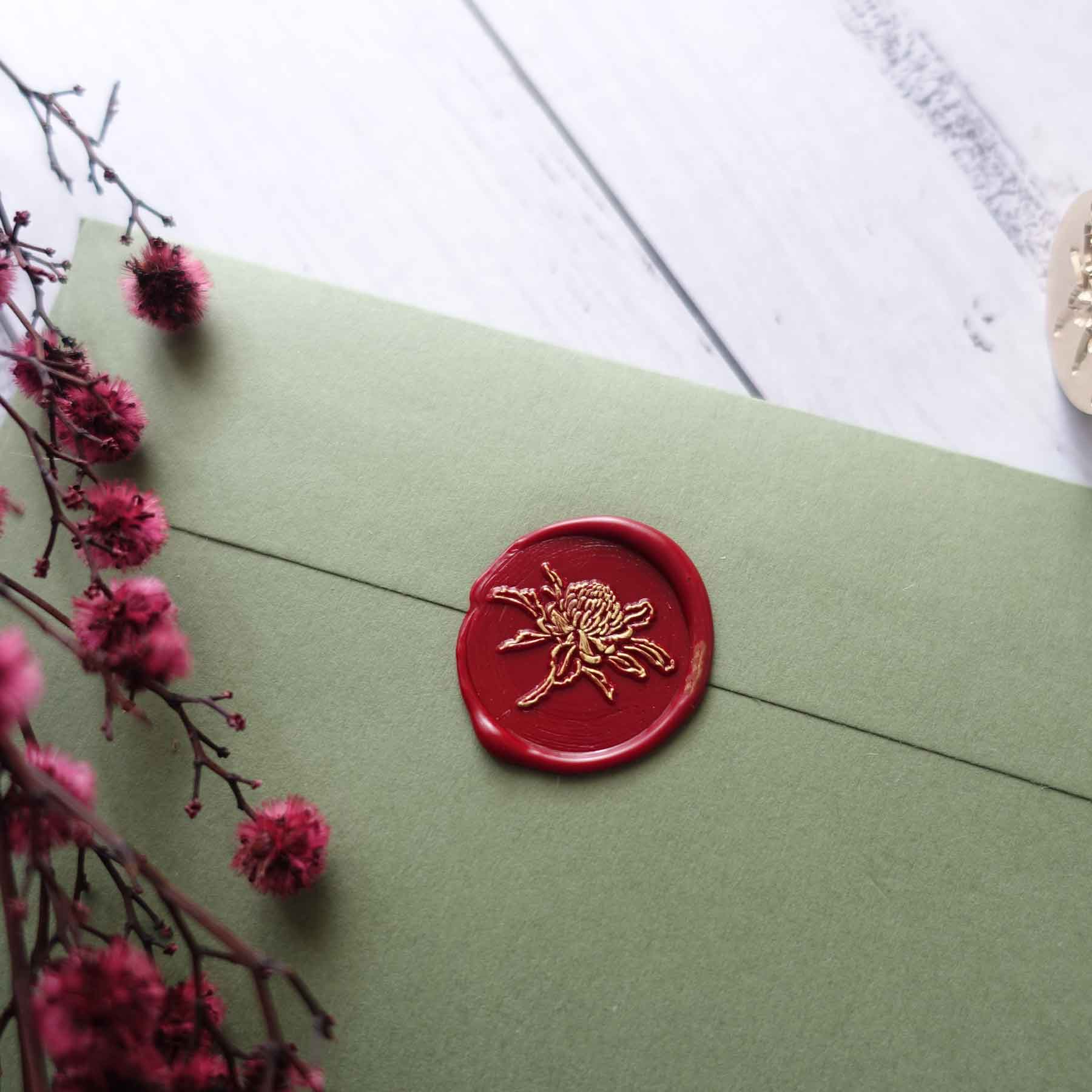 Waratah flower crimson red wax seal on olive green envelope