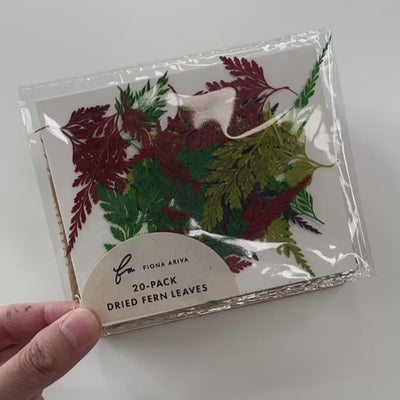 christmas gift wrapping with dried leaves and wax seals