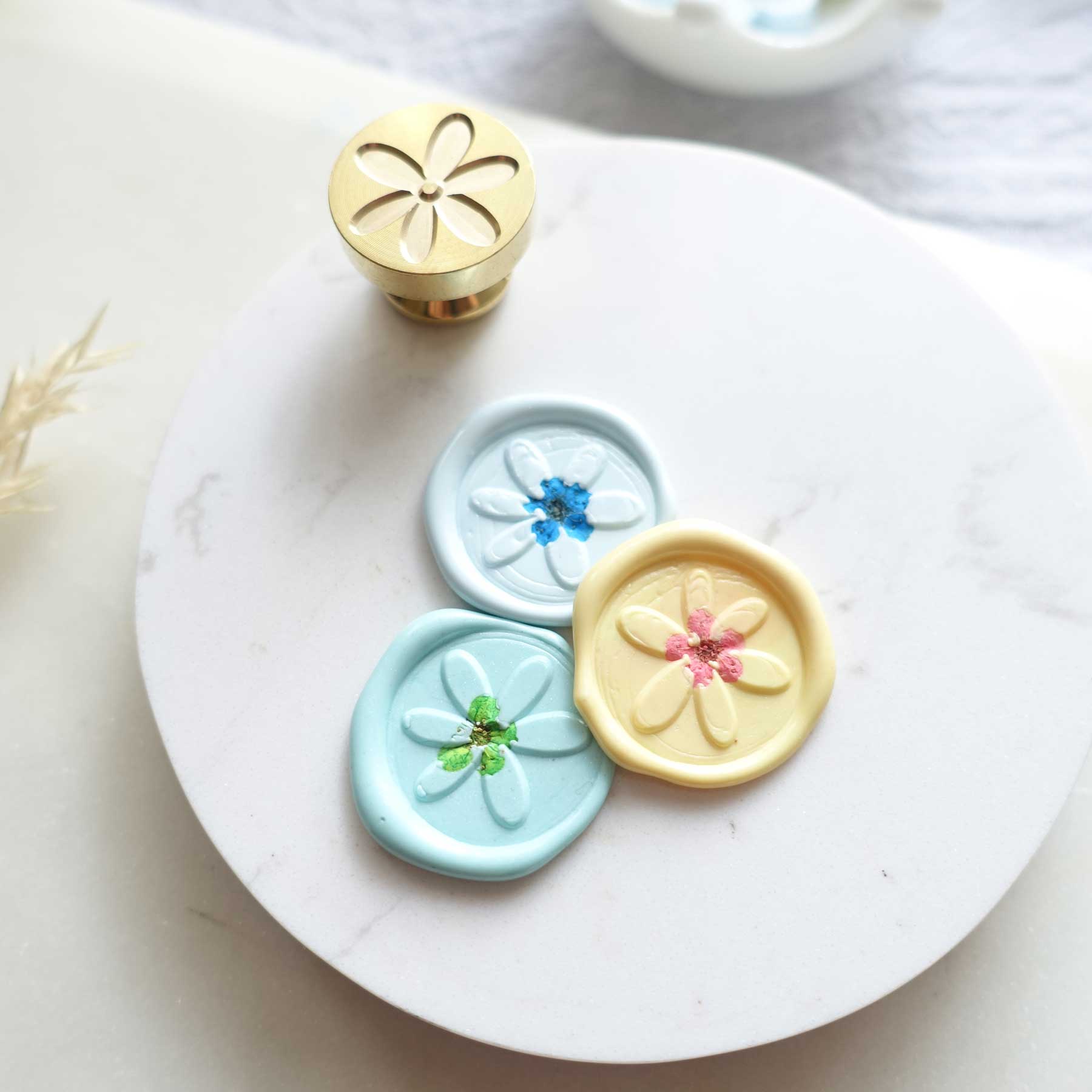 mini daisy wax seal stamp with tiny dried flowers