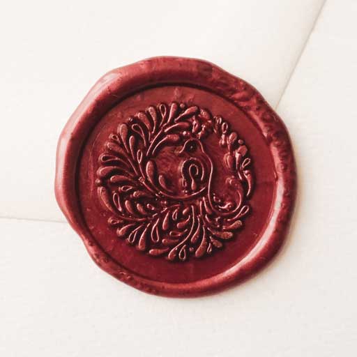 Song bird peacock burgundy wine wax seal stamp on envelope